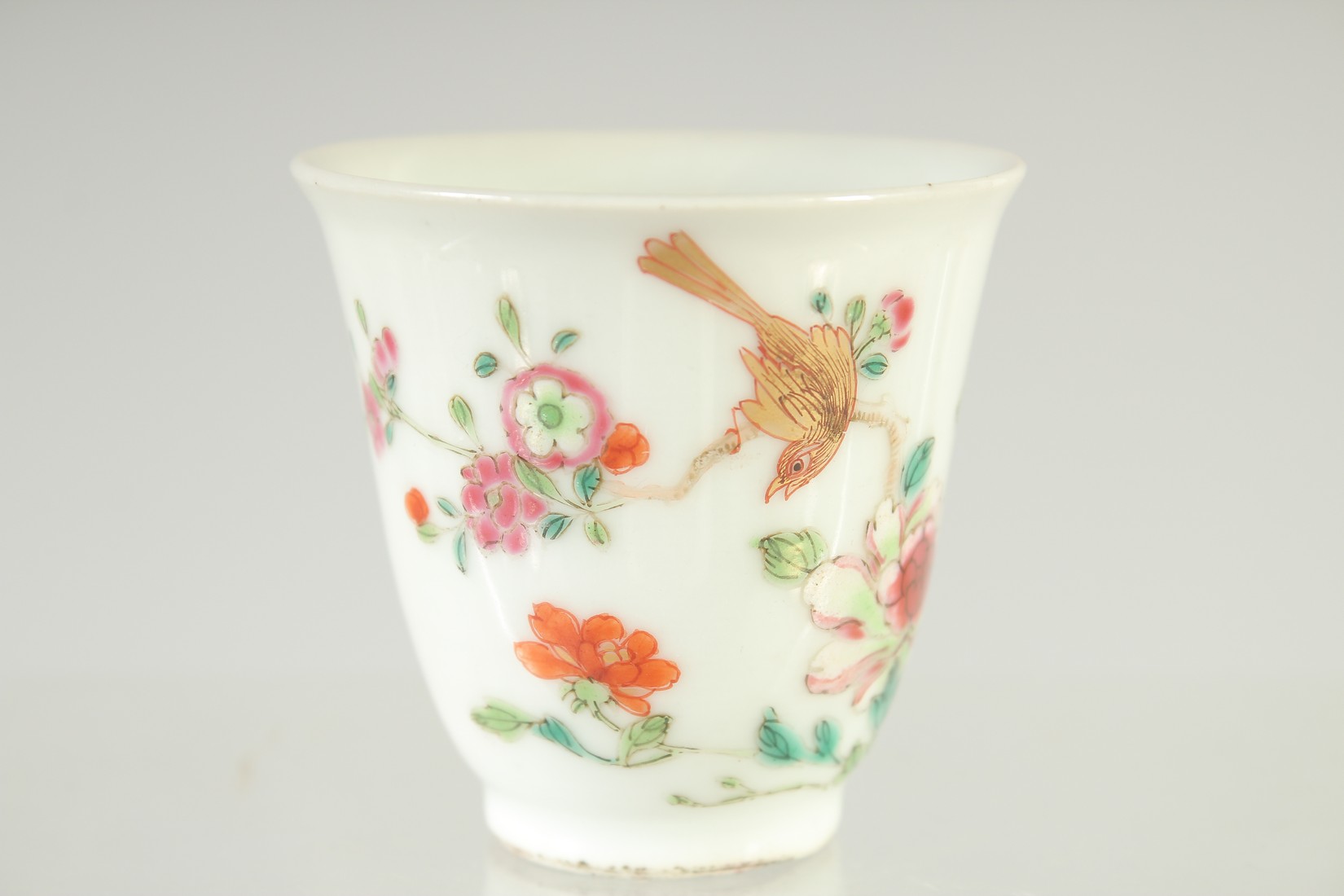 A 19TH CENTURY CHINESE FAMILLE ROSE PORCELAIN TEACUP, painted with a bird and flora, 6cm high. - Image 2 of 6