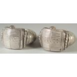 A PAIR OF ISLAMIC SILVER SLAVE BANGLES, with embossed and chased decoration, weight 810G.