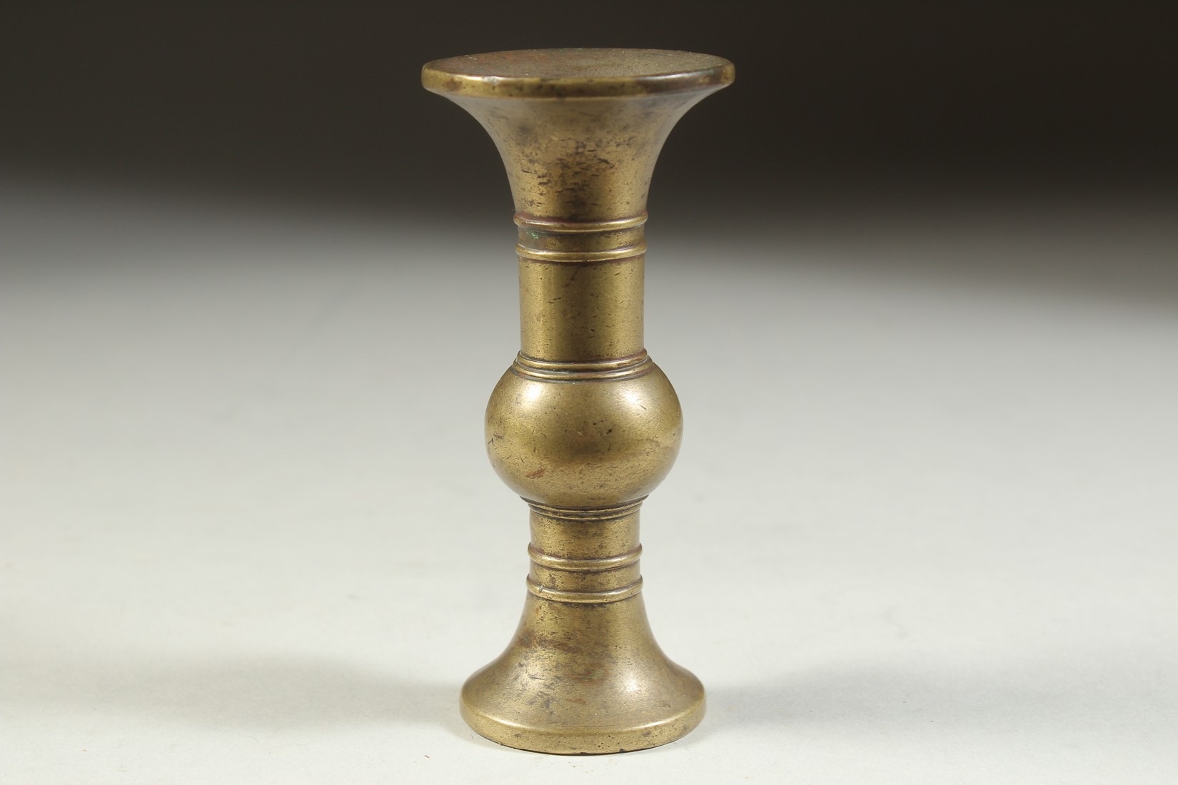 A SMALL CHINESE BRASS GU SHAPE VASE, 10cm high. - Image 2 of 4
