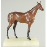 A BERGMAN-STYLE COLD PAINTED FIGURE OF A HORSE, mounted to a rectangular onyx base, 16cm high.