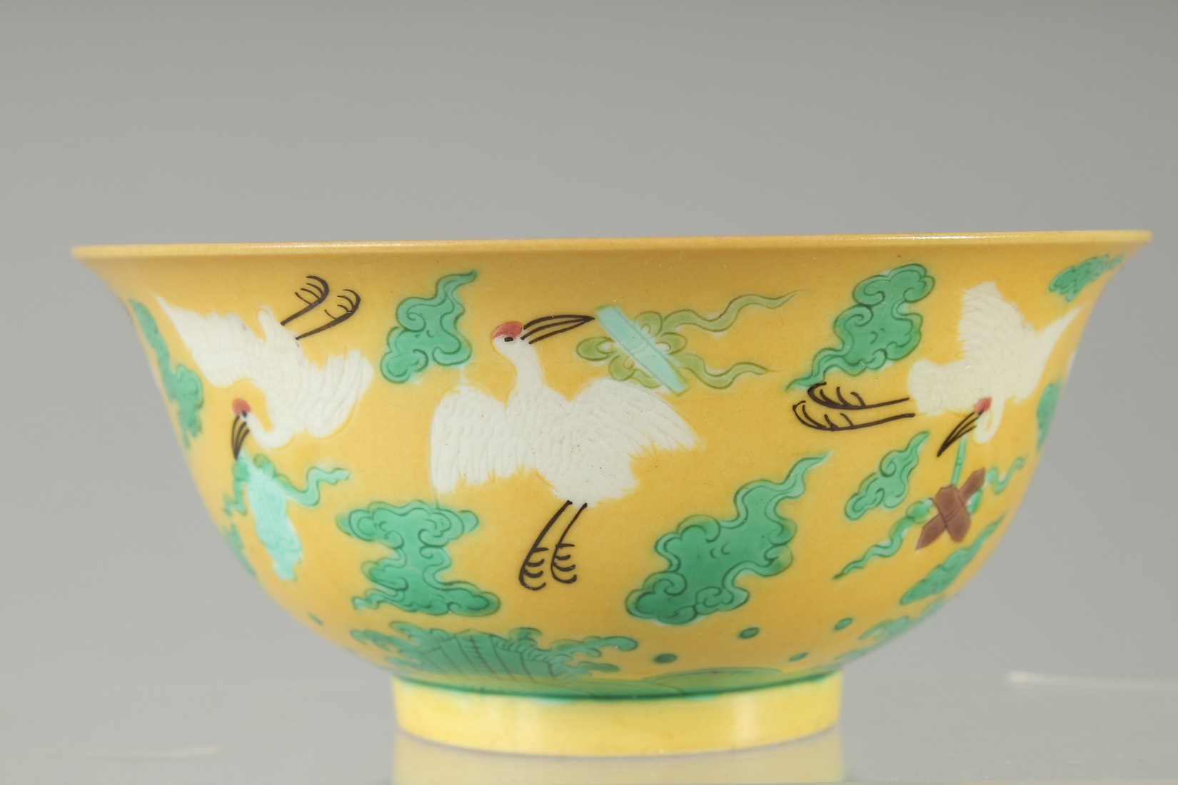 A CHINESE YELLOW GROUND ENAMELLED CRANE BOWL, with longevity symbol to interior and character mark - Image 4 of 7