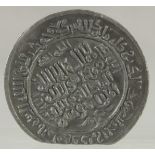 AN ISLAMIC CALLIGRAPHIC METAL MEDALLION, 5cm diameter.