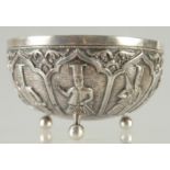 A RARE INDIAN PARSI SILVER BOWL, with embossed and engraved figures and raised on three ball feet,