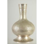 A SMALL ISLAMIC ENGRAVED WHITE METAL VASE, 17.5cm high.