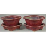 A PAIR OF CHINESE JUN WARE POTTERY PLANT POTS AND STANDS, (4 pieces).