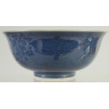 A CHINESE BLUE GLAZE PORCELAIN BOWL, with incised dragons, the base with six-character mark, 16cm