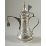 A GOOD SMALL ISLAMIC SILVER EWER, with hinged cover and strapwork handle, curving spout, body and