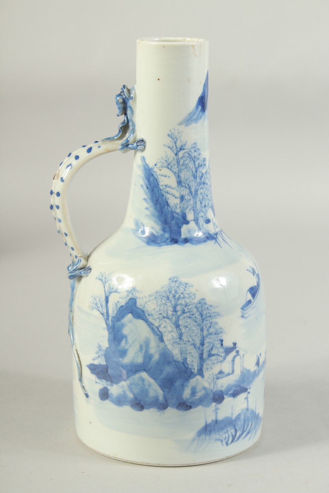 A JAPANESE ARITA BLUE AND WHITE PORCELAIN JUG, painted with landscape and with dragon formed handle, - Image 3 of 8