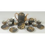 A GOOD JAPANESE BLACK AND GILT PORCELAIN TEA SET, comprising teapot, jug, sugar bowl, and six cups