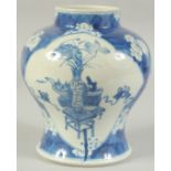 A CHINESE BLUE AND WHITE PORCELAIN JAR, painted with panels of vases and objects, character mark