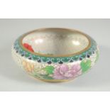 A CHINESE CLOISONNE BOWL, decorated with flora, 13cm diameter.