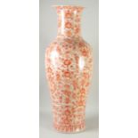 A LARGE DECORATIVE CHINESE IRON RED AND WHITE PORCELAIN FLOOR-STANDING VASE, painted with flora,