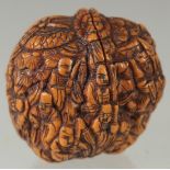 A CHINESE CARVED WALNUT.