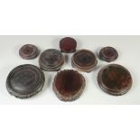 A COLLECTION OF EIGHT CHINESE HARDWOOD STANDS, various sizes, largest 17.5cm diameter.