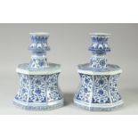 A LARGE PAIR OF CHINESE BLUE AND WHITE PORCELAIN CANDLESTICKS, decorated with panels of flora,