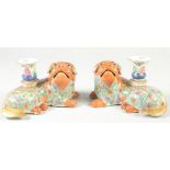 A FINE PAIR OF CHINESE CANTON FAMILLE ROSE PORCELAIN FOO DOG CANDLESTICKS, painted with floral