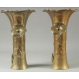 A PAIR OF JAPANESE PETAL FORMED BRASS VASES, with relief floral decoration, both with impressed mark