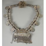 A LARGE ISLAMIC SILVER AND GILT METAL MARRIAGE NECKLACE, with attached coins dated 1780.