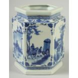 A CHINESE BLUE AND WHITE PORCELAIN HEXAGONAL BRUSH POT, decorated with panels of scenes with figures