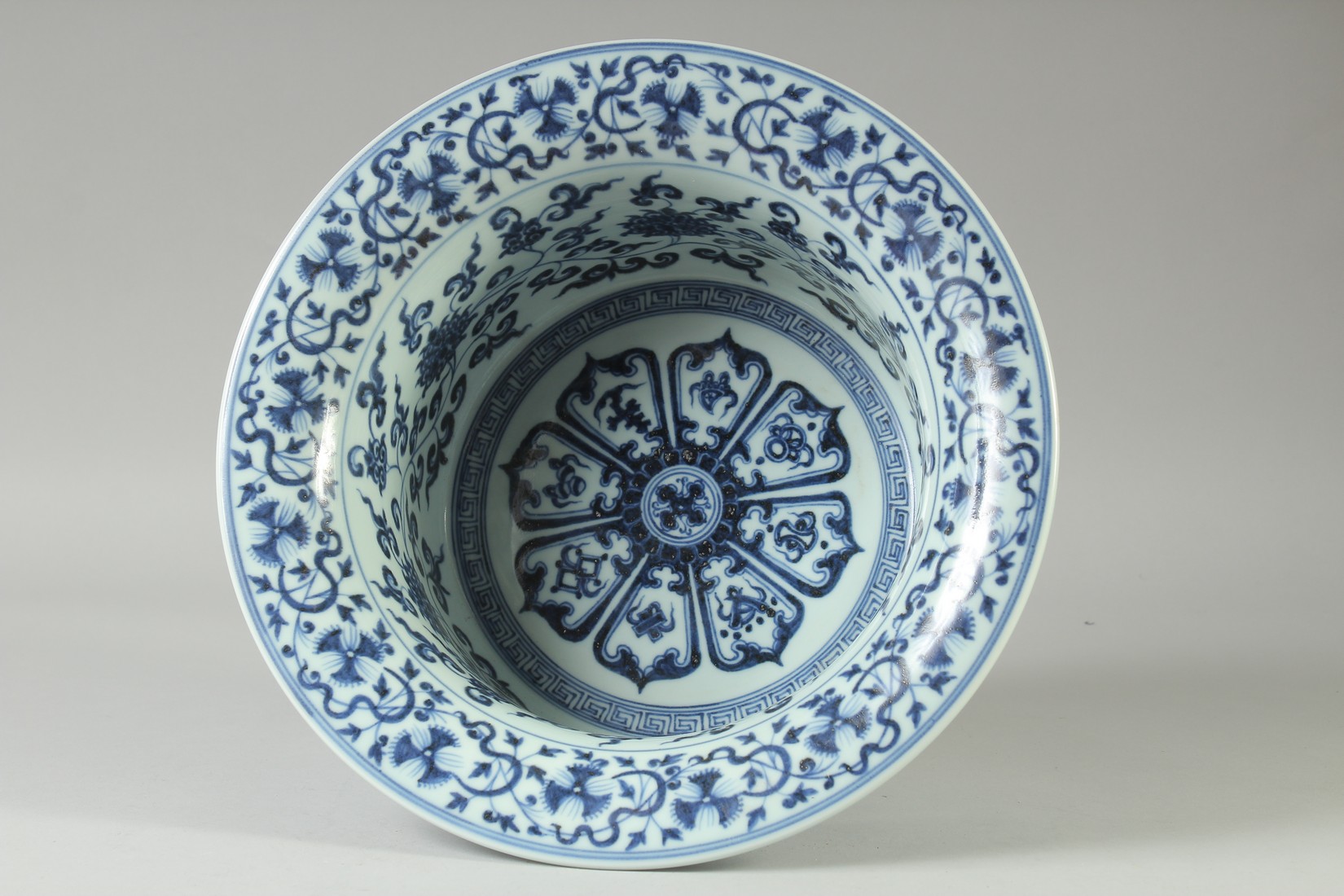 A CHINESE BLUE AND WHITE PORCELAIN WATER BASIN, the interior with auspicious symbols and lotus, 31. - Image 4 of 5