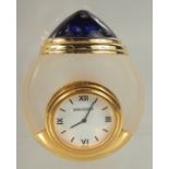 A BOUCHERON GLASS CLOCK in a case. 3ins.