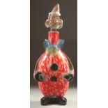A MURANO SPECKLED GLASS CLOWN BOTTLE, the head as a stopper. a/f 12ins high.