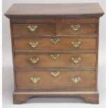 AN 18TH CENTURY OAK STRAIGHT FRONT CHEST of two short and three long graduated drawers with brass