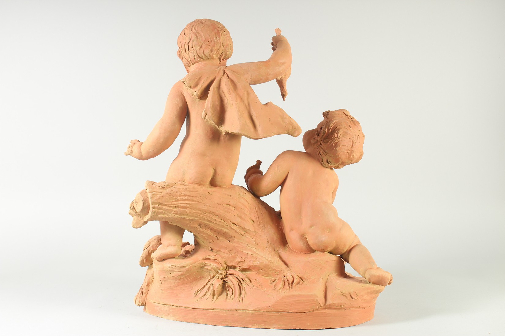 A GOOD LATE 19TH CENTURY TERRA COTTA GROUP, depicting two children tormenting a dog, holding a - Image 5 of 6