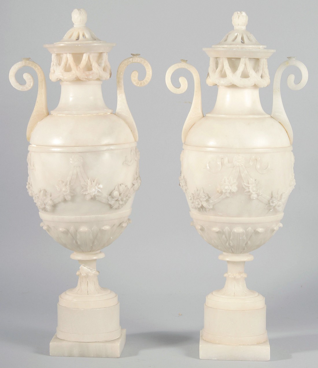 A VERY GOOD PAIR OF 19TH CENTURY FRENCH ALABASTER, TWO HANDLED URNS AND COVERS, carved with garlands