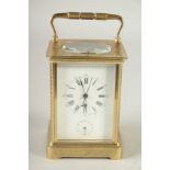 A GOOD 19TH CENTURY FRENCH ENGRAVED BRASS CARRIAGE CLOCK, repeater with alarm, in a leather carrying