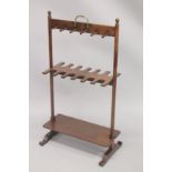 A RARE 19TH CENTURY MAHOGANY RACK with twelve segment hanging spaces, with a plain under tier. 3ft