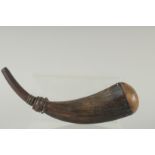 AN EARLY HORN SHAPED POWDER FLASK. 12ins high.