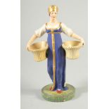 A RARE RUSSIAN PORCELAIN FIGURE OF A LADY, POSSIBLY ST. PETERSBURG, in a blue dress carrying two