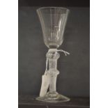 AN 18TH CENTURY ENGLISH WINE GLASS with inverted bell bowl and air twist stem, with knop.