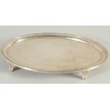 A GEORGE III ENGRAVED OVAL SILVER SALVER on four curving legs. 11.5ins long. London 1796. Maker,