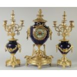 A SUPERB 19TH CENTURY SEVRES BLUE THREE PIECE CLOCK SET with ormolu mounts, the side panels with
