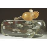 A NOVELTY GLASS CHEESE with a mouse. 8ins long.