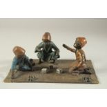 A COLD CAST BRONZE THREE BOYS PLAYING DICE 10ins long.