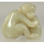 A CHINESE CARVED JADE MONKEY AND PEACH. 1.75ins long.