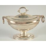 A GEORGE III OVAL SILVER SAUCE TUREEN AND COVER by PAUL STORR with gadrooned edges and ring handles.