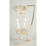 A CHRISTOPHER DRESSER STYLE GLASS CLARET JUG with plated mounts, 10.5ins high.