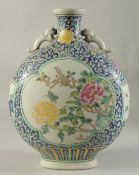 A CHINESE PORCELAIN MOON FLASK with panels of birds and flowers. 14ins high.