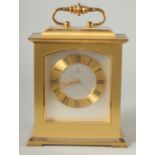 A HEAVY BRASS CLOCK by LOOPING with quartz movement and carrying handles. 9ins high.