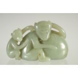 A CHINESE CARVED JADE CARVING OF TWO MONKEYS. 2.75ins.