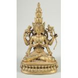 A GOOD GILT BRONZE FIGURE PRAYING set with coral. 11ins high.