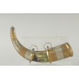 AN EARLY ISLAMIC HORN AND BRASS MOUNTED POWDER HORN. 10ins long.
