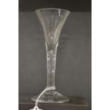 AN 18TH CENTURY ENGLISH WINE GLASS with tapering bowl.