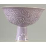 A CHINESE PURPLE GLAZE CARVED DRAGON STEM CUP.