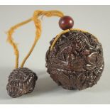 A JAPANESE CARVED WOOD BALL INRO AND ROPE carved with insects. 2ins diameter.