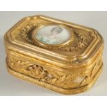 A GOOD FRENCH PALAIS ROYAL GILT BOX AND COVER the top inset with a circular miniature of a lady.